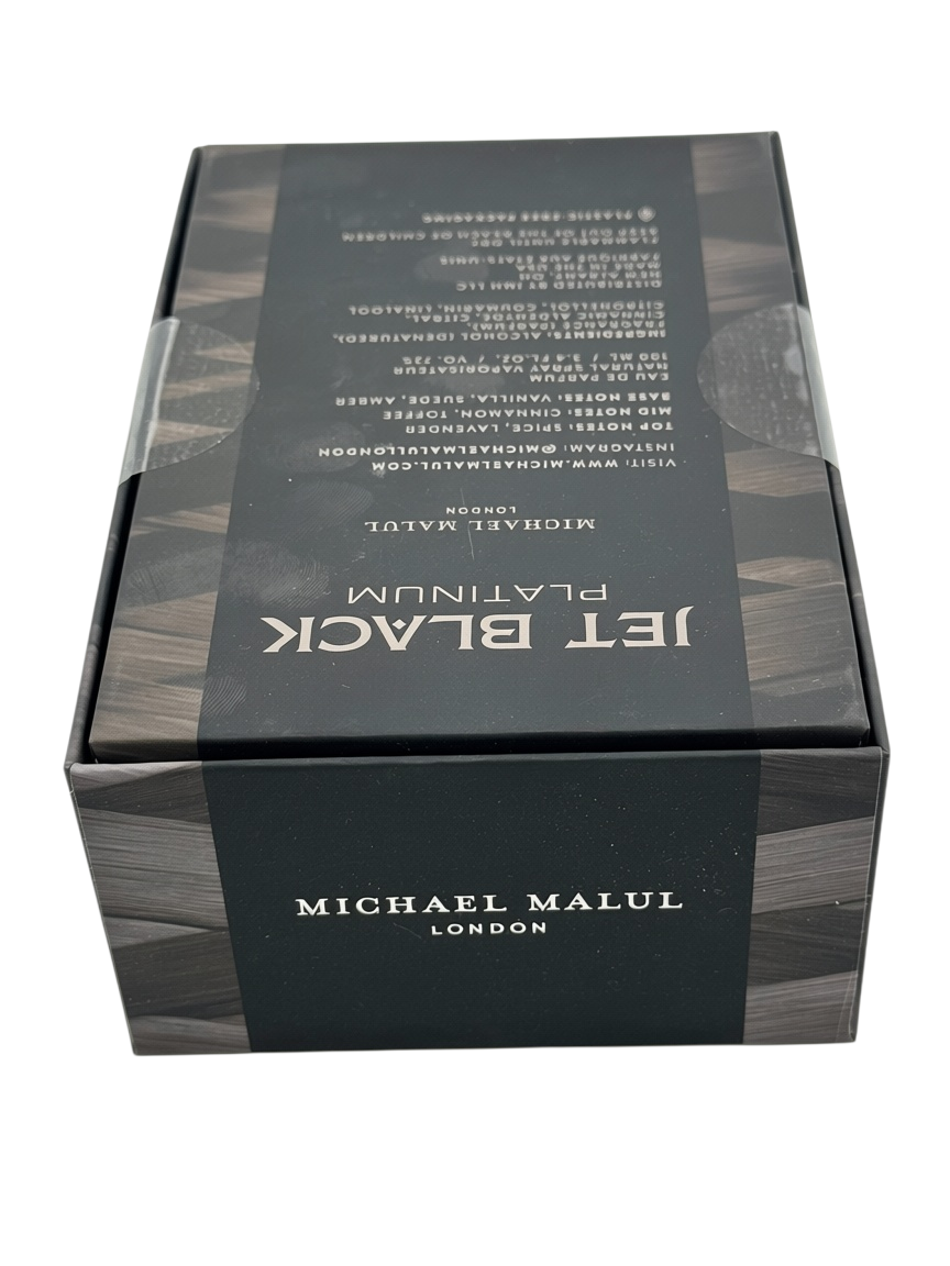 Paradime Enterprise LLC Jet Black Platinum by Michael Malul fragrance box featuring black and grey wood grain design